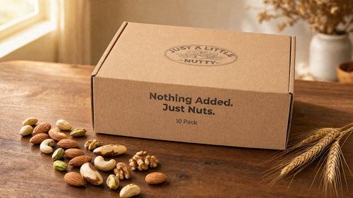 Just a Little Nutty 10-Pack box on a warm table with loose nuts