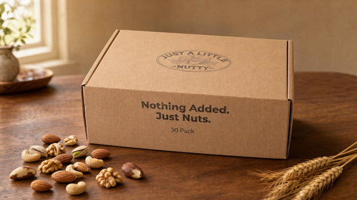 Just a Little Nutty 30-Pack box on a warm table with loose nuts